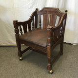 Vintage Jacobean Revival Solid Walnut & Brown Vinyl Rolling Armchair