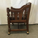 Vintage Jacobean Revival Solid Walnut & Brown Vinyl Rolling Armchair
