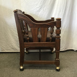 Vintage Jacobean Revival Solid Walnut & Brown Vinyl Rolling Armchair