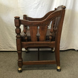 Vintage Jacobean Revival Solid Walnut & Brown Vinyl Rolling Armchair