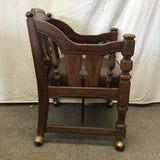 Vintage Jacobean Revival Solid Walnut & Brown Vinyl Rolling Armchair